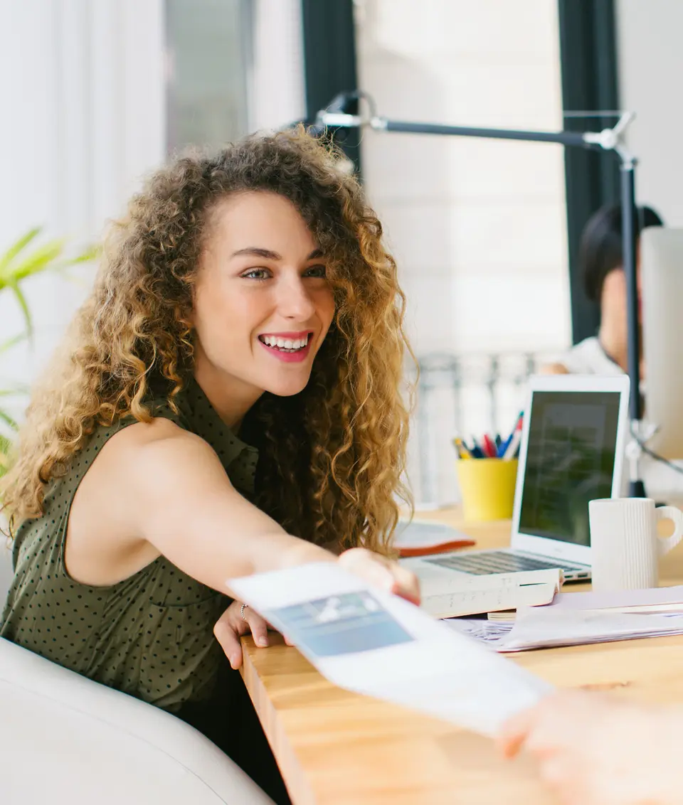 Person conversing with a colleague in a work environment