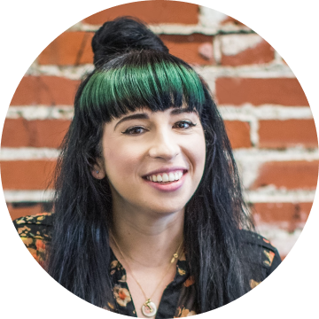 Smiling Woman with Black Hair and Green Bangs