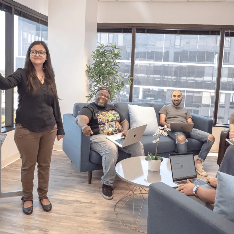 Spokeo team watching a colleague present during a hiring review